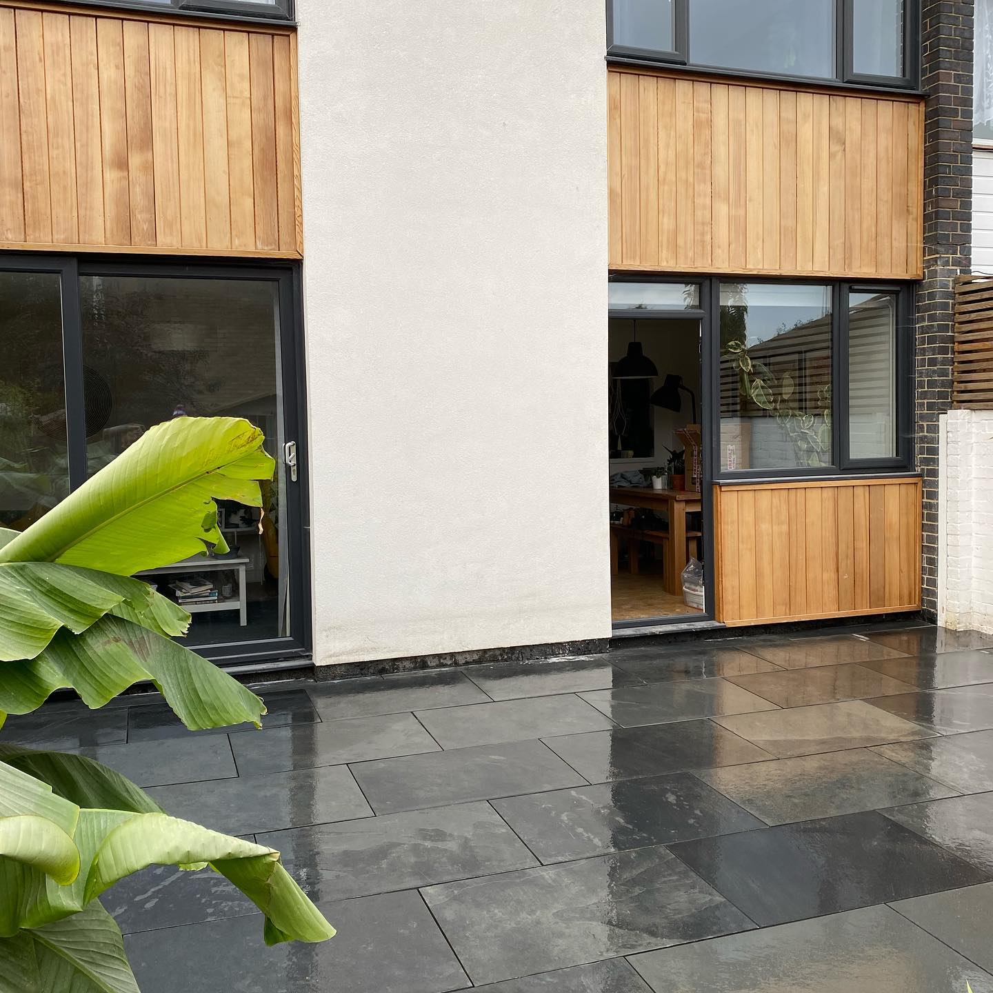 Modern house exterior with slate patio