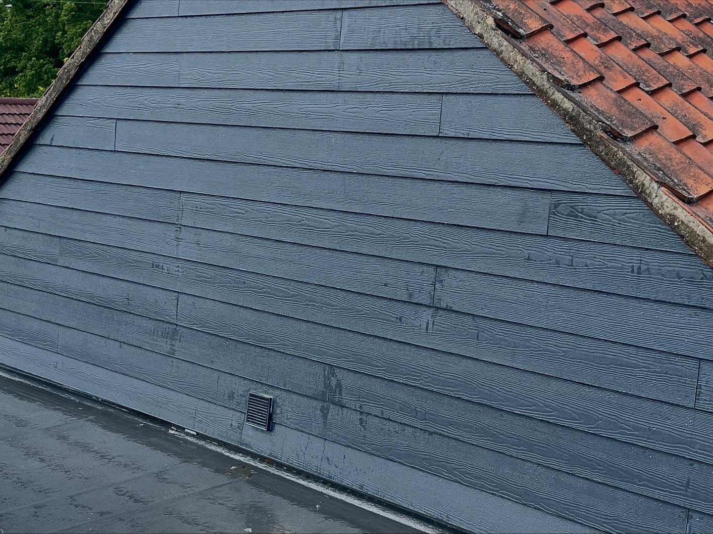 Dormer cheek with horizontal textured cladding