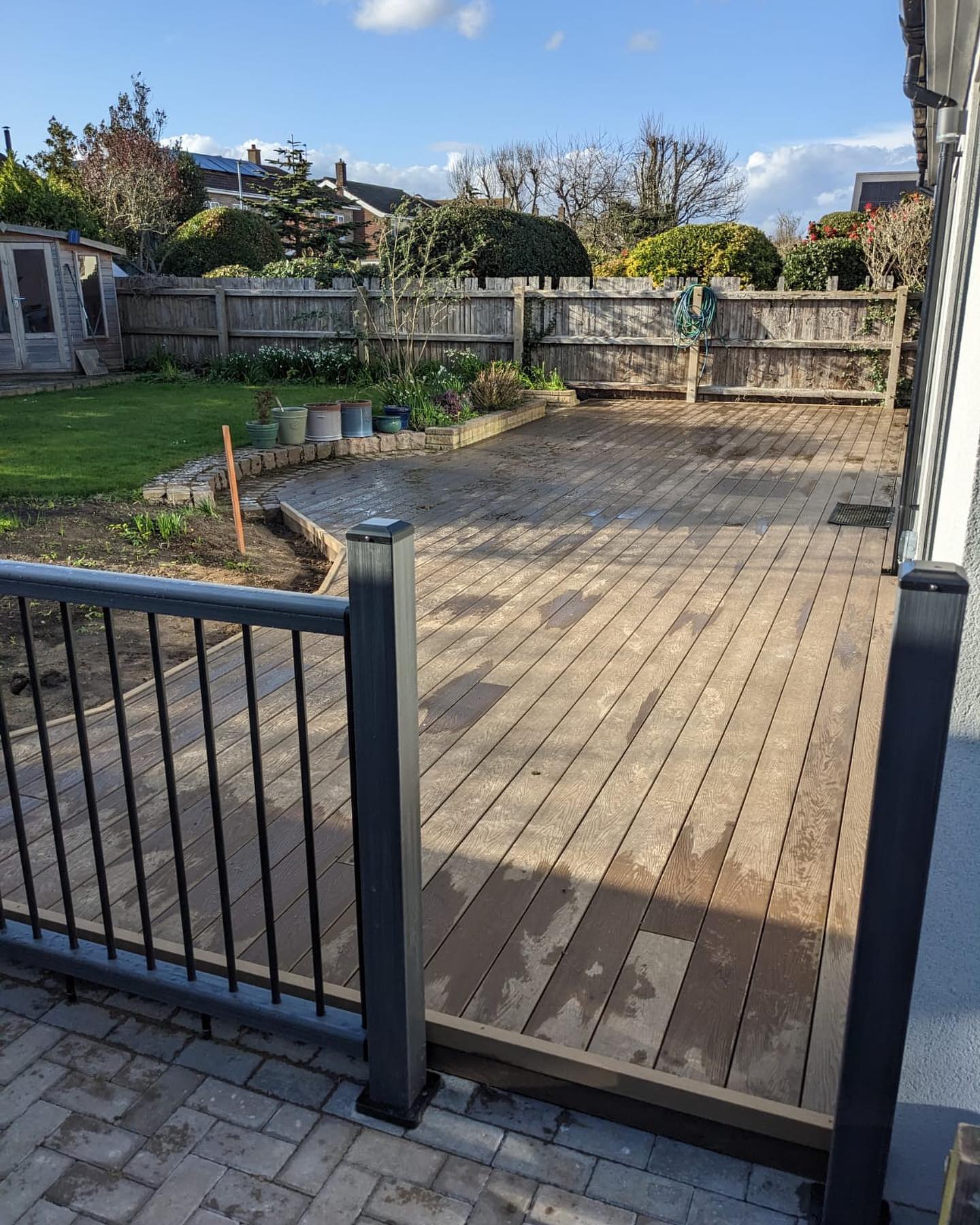 Raised timber deck with metal balustrade