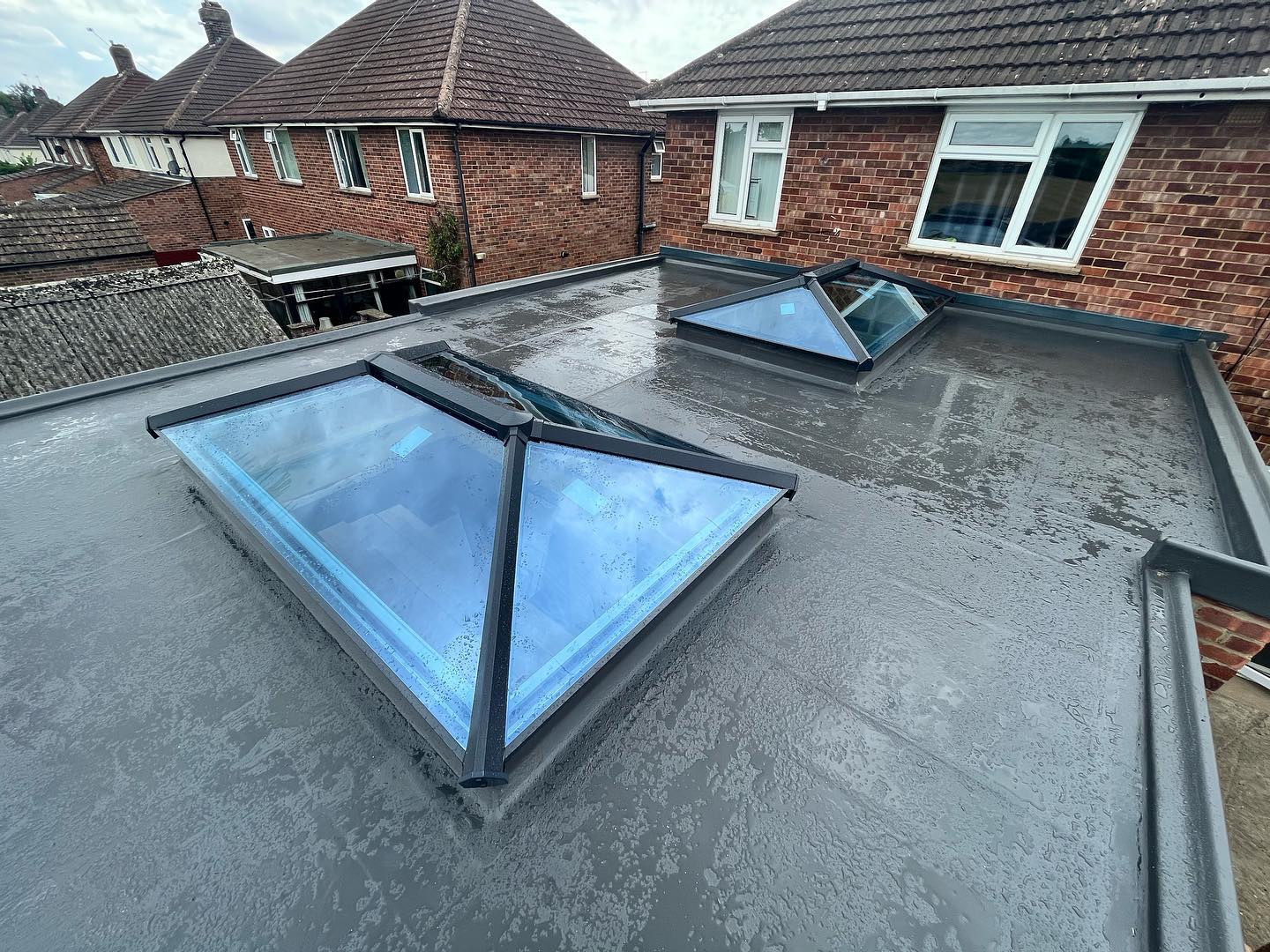 Flat roof with dual roof lanterns and lead flashings